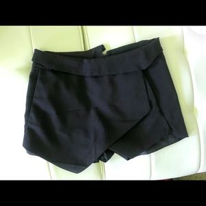 black S asymmetrical skort